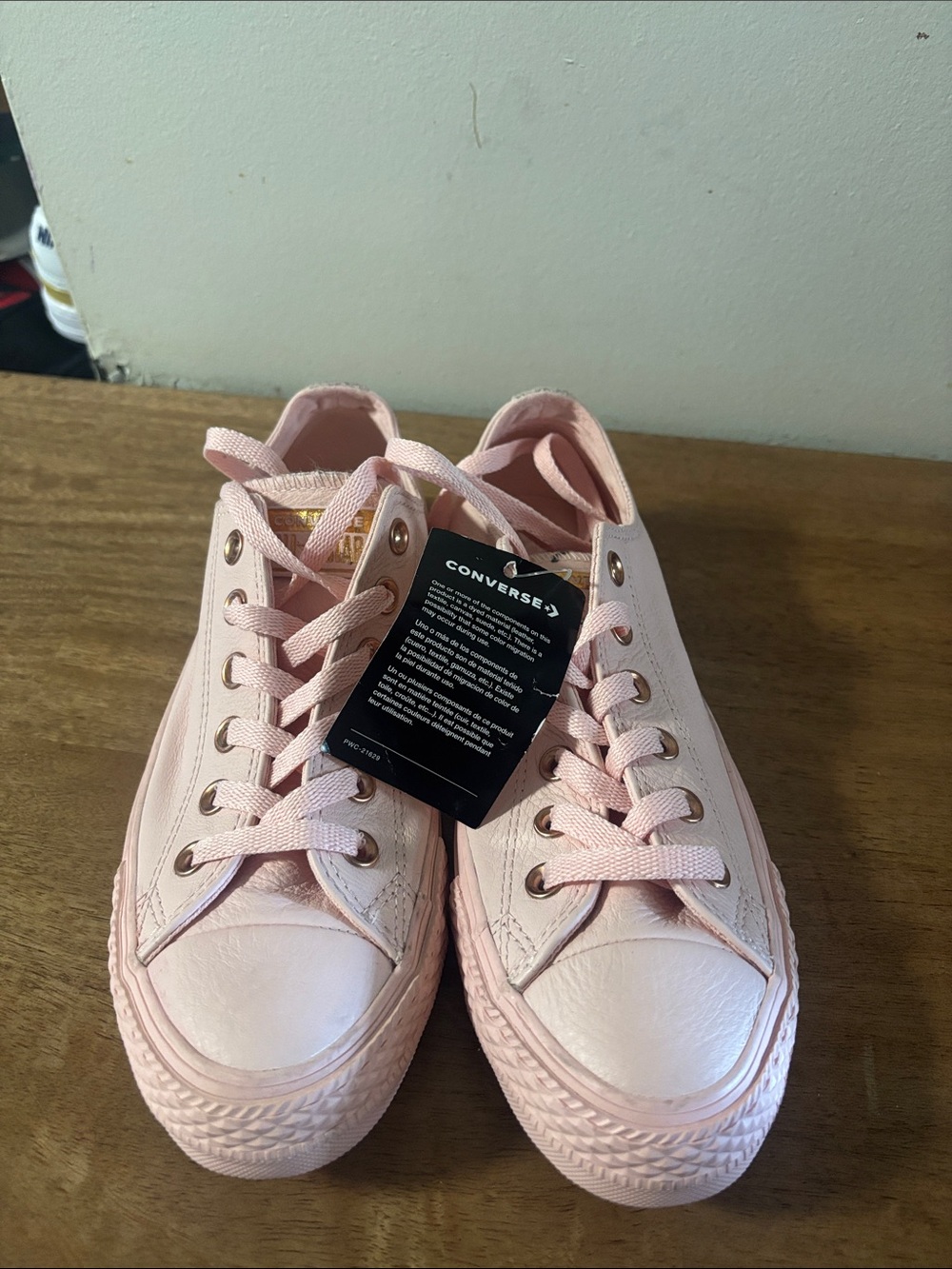 Converse Women’s Low-Top Canvas Sneakers in Light Pink. Side 7.5